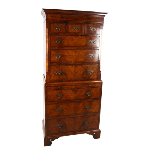 1126 - A 19th century walnut chest on chest of small size, with brushing slide and pierced brass drop handl... 