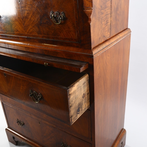 1126 - A 19th century walnut chest on chest of small size, with brushing slide and pierced brass drop handl... 