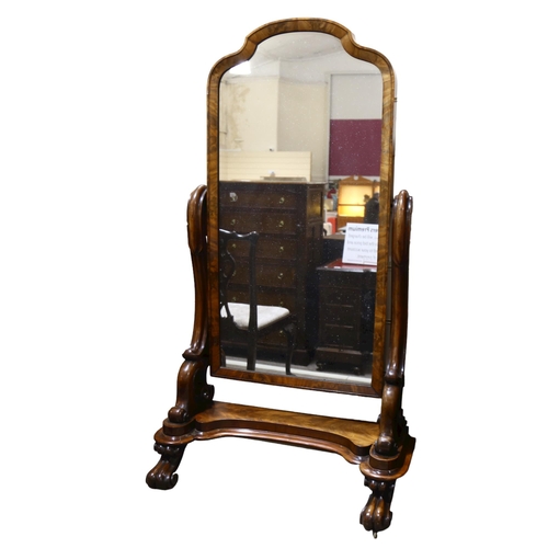 1129 - A 19th century mahogany cheval mirror, with carved and scrolled supports, overall height 160cm