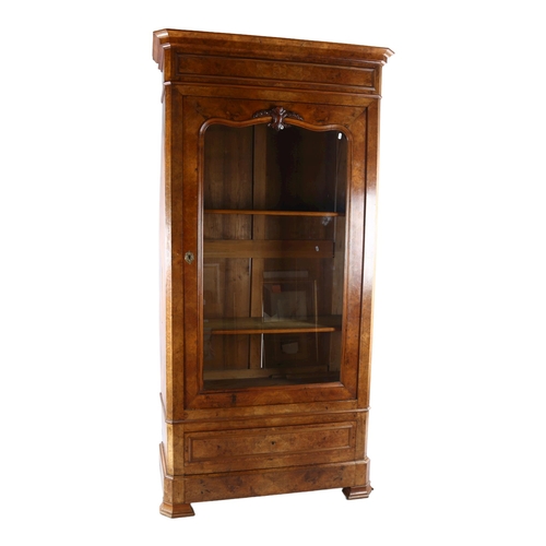 1127 - A 19th century Continental walnut cabinet, with shaped glazed panelled door and drawer below, width ... 