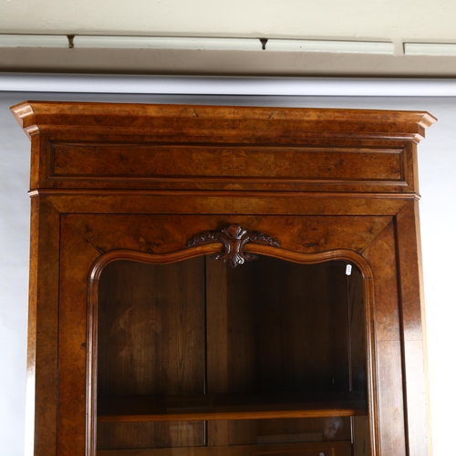 1127 - A 19th century Continental walnut cabinet, with shaped glazed panelled door and drawer below, width ... 