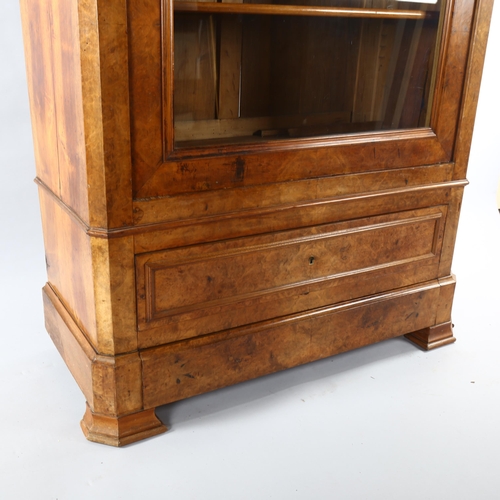 1127 - A 19th century Continental walnut cabinet, with shaped glazed panelled door and drawer below, width ... 