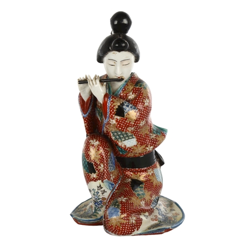 1136 - Japanese porcelain figure of a woman playing a flute, height 26cm