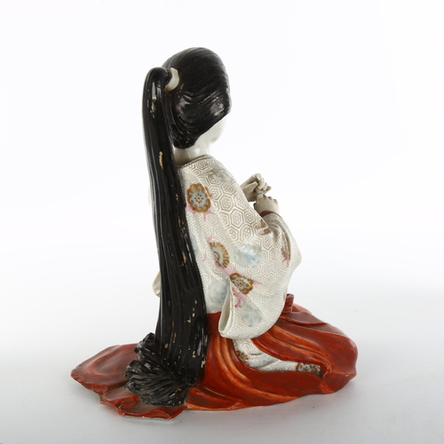 1137 - Japanese porcelain figure of a kneeling girl, height 25cm