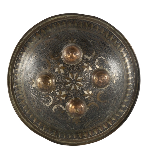 1140 - 19th century Indo-Persian brass shield with engraved decoration, diameter 22cm