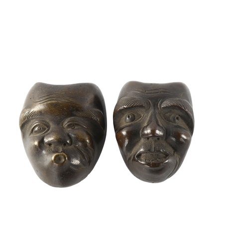 1141 - A pair of miniature Chinese cast-bronze masks, height 4cm