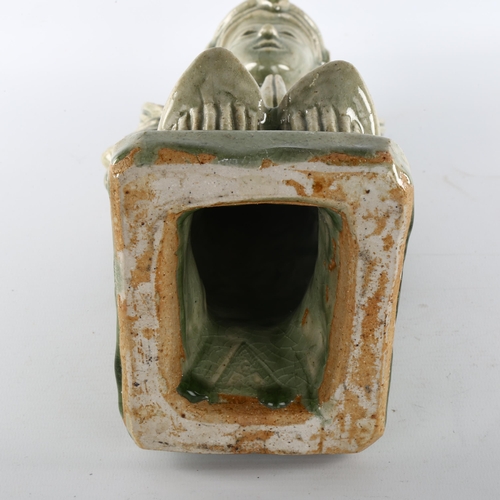 1148 - A Thai celadon glaze pottery temple figure, height 40cm