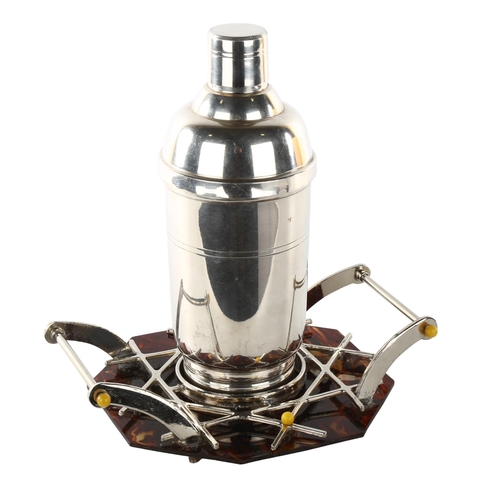 1169 - A French Art Deco electroplate cocktail shaker, on simulated tortoiseshell and silver plate stand