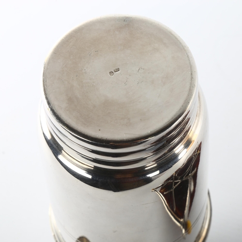 1169 - A French Art Deco electroplate cocktail shaker, on simulated tortoiseshell and silver plate stand