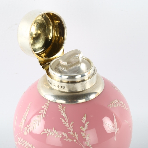 1172 - A pink glass globular perfume bottle, with painted dragonflies and grass, hallmarked hinged silver t... 