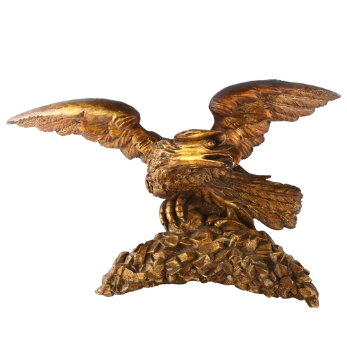 1175 - A Georgian carved giltwood eagle design pediment, wingspan 55cm