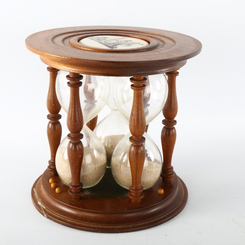 1177 - A reproduction mahogany 3-section egg timer, diameter 14cm, height 14cm