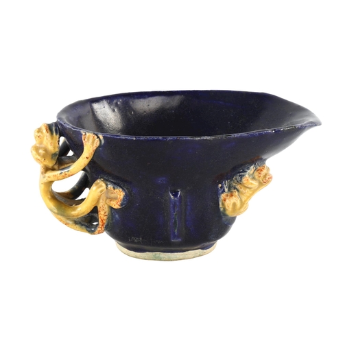 1186 - A Chinese blue and yellow glaze libation cup, with chilong dragon mounts, length 12cm