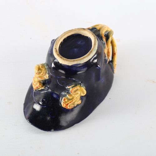 1186 - A Chinese blue and yellow glaze libation cup, with chilong dragon mounts, length 12cm