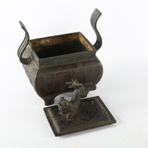 1189 - A Chinese patinated bronze incense burner, with dog of fo finial and 6 character mark, height 17cm