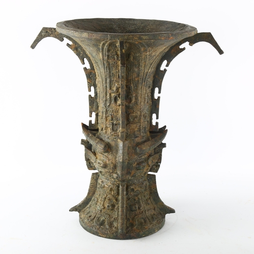 1191 - A Chinese Archaic style bronze Gu shaped vase, with script mark to base, height 31cm