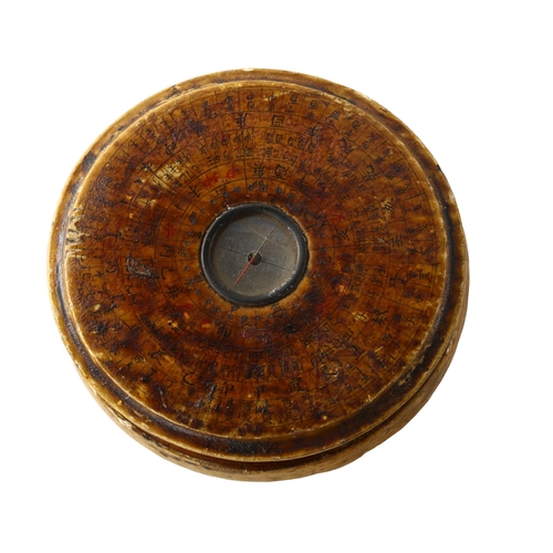 1195 - A Chinese wooden-cased celestial calendar compass, diameter 10cm