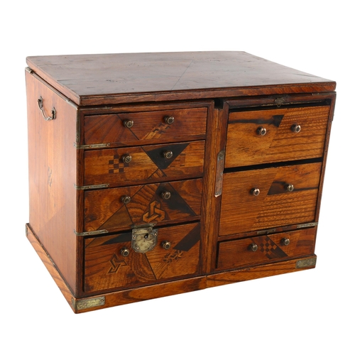 1205 - A Japanese inlaid wood travelling cabinet with parquetry decoration, width 33cm, height 24cm