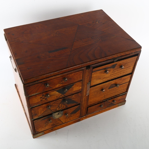 1205 - A Japanese inlaid wood travelling cabinet with parquetry decoration, width 33cm, height 24cm