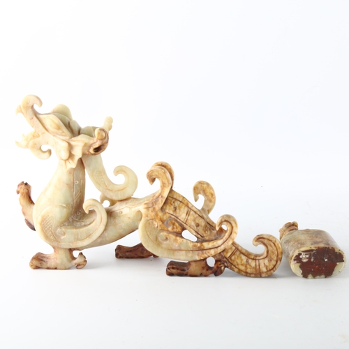 1206 - A Chinese carved stone dragon, length 26cm, and a carved stone seal with dog of fo mount, height 8cm... 