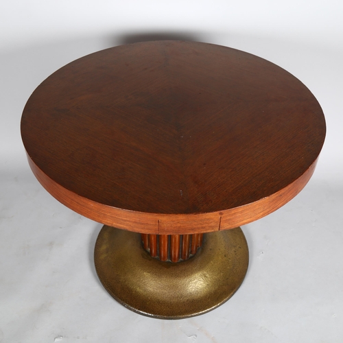 1018 - An Austrian Secessionist games table, circular top with pull out and drop down drinks holders, raise... 