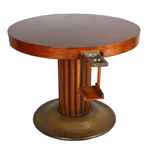 1018 - An Austrian Secessionist games table, circular top with pull out and drop down drinks holders, raise... 