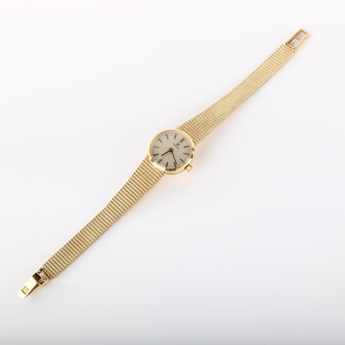 16 - OMEGA - a lady's 9ct gold mechanical bracelet watch, circa 1977, silvered dial with gilt baton hour ... 