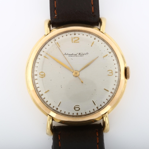 4 - IWC (INTERNATIONAL WATCH CO) - a Vintage 18ct gold mechanical wristwatch, circa 1950s, silvered dial... 