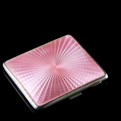 524 - An Art Deco George V silver and pink enamel cigarette case, rectangular form with engine turned deco... 