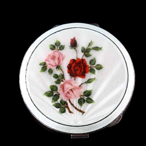 526 - An Elizabeth II silver and enamel compact, circular form with hand painted rose decoration, by Walke... 