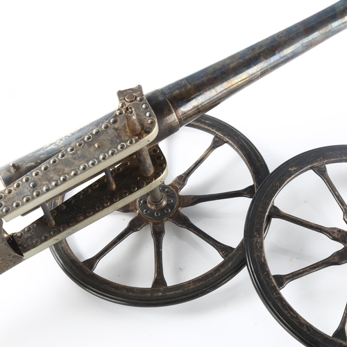 543 - A good quality early 20th century Indian white metal model table cannon, inscribed 