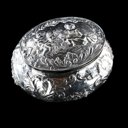 550 - A Continental 800 silver dressing table box, relief embossed putti and floral decoration, maker's ma... 