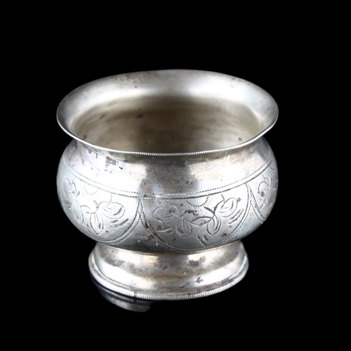 551 - A 19th century Russian silver salt cellar, with bright-cut engraved decoration, diameter 5cm, 0.8oz