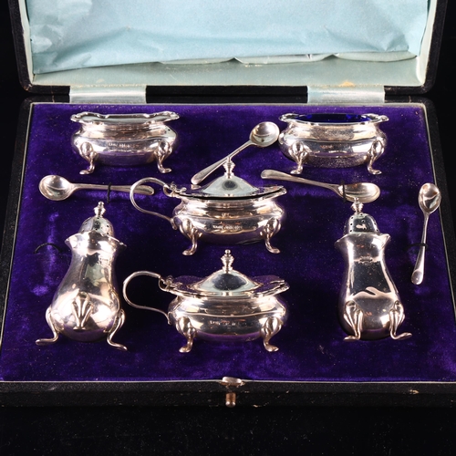 559 - A George V silver 6-piece cruet set, with blue glass liners, by Walker & Hall, hallmarks Birmingham ... 