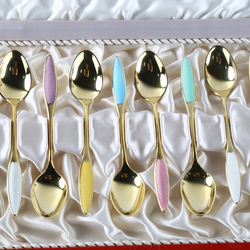 573 - FRIGAST - a set of 12 Danish vermeil sterling silver and harlequin enamel coffee spoons, length 9.5c... 