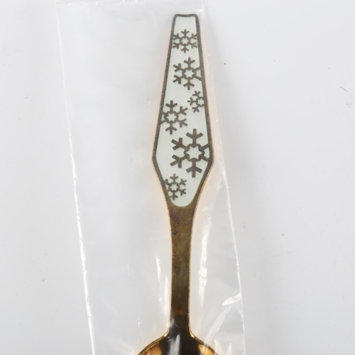 574 - SORENCO - a Danish modernist vermeil sterling silver and white enamel snowflake Christmas spoon, sta... 