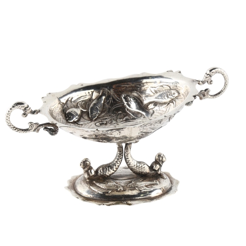 582 - A 19th century Spanish silver pedestal table salt, with relief embossed fish decoration and mermaid ... 