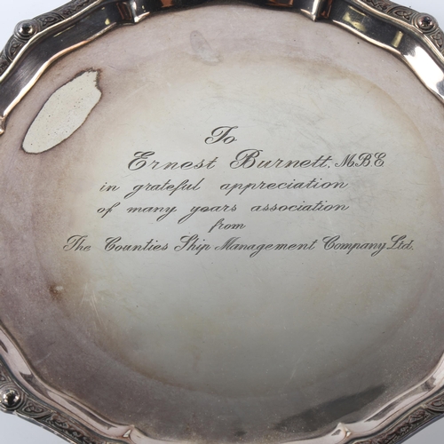 590 - An Elizabeth II silver salver, circular form with Celtic design border and personalised inscription ... 