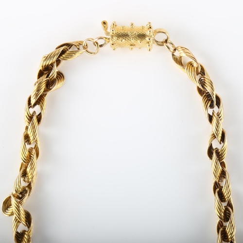 102 - A heavy 15ct gold fancy link chain necklace, with cannetille barrel clasp, necklace length 40cm, 46.... 