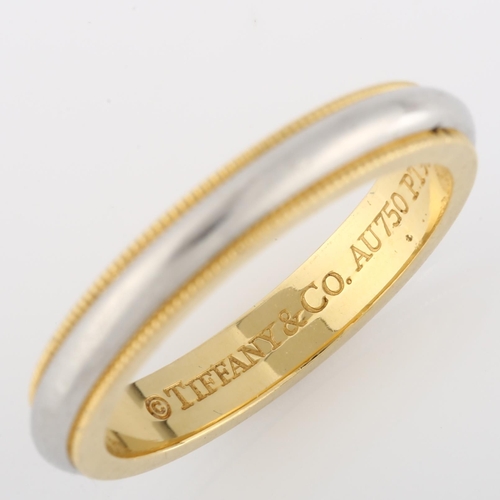 109 - TIFFANY & CO - a platinum and 18ct gold Classic Milgrain wedding band ring, band width 3.3mm, size M... 