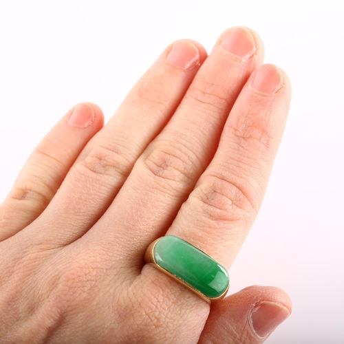 114 - A Chinese 18ct gold jade tank ring, set with oval cabochon jade, setting height 10.3mm, size S, 7.8g