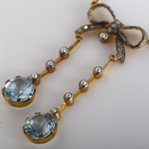 121 - A modern 9ct gold blue topaz pearl and diamond ribbon bow negligee pendant necklace, in Edwardian st... 