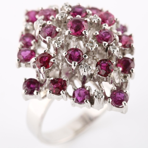 124 - A large 18ct white gold ruby and diamond cocktail ring, set with round-cut rubies and single-cut dia... 