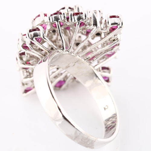 124 - A large 18ct white gold ruby and diamond cocktail ring, set with round-cut rubies and single-cut dia... 