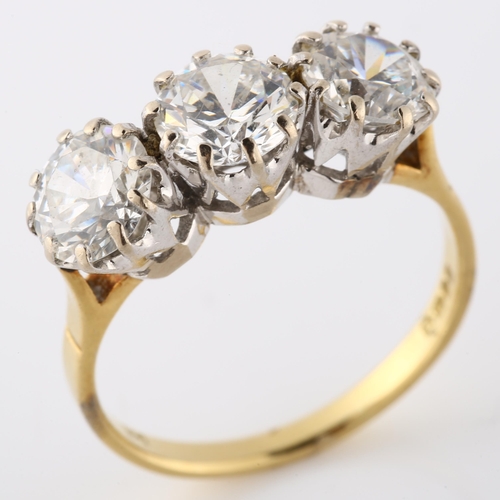 126 - An 18ct gold three stone paste ring, set with modern round brilliant-cut paste, paste measures: 7.00... 