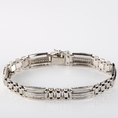 129 - A heavy 14ct white gold diamond panel bracelet, set with Princess-cut diamonds, total diamond conten... 