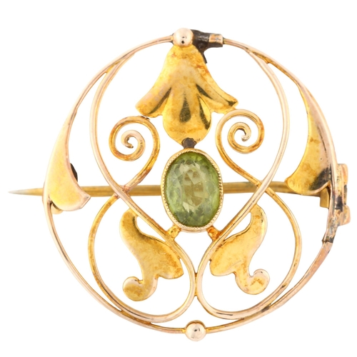 132 - MURRLE BENNETT - an Art Nouveau 9ct gold peridot openwork brooch, set with oval mixed-cut peridot, b... 