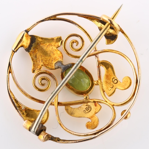 132 - MURRLE BENNETT - an Art Nouveau 9ct gold peridot openwork brooch, set with oval mixed-cut peridot, b... 