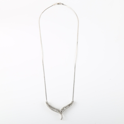 133 - A modern 9ct white gold diamond crossover pendant necklace, set with baguette and single-cut diamond... 