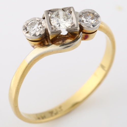 141 - An 18ct gold three stone diamond crossover ring, platinum-topped set with modern round brilliant-cut... 